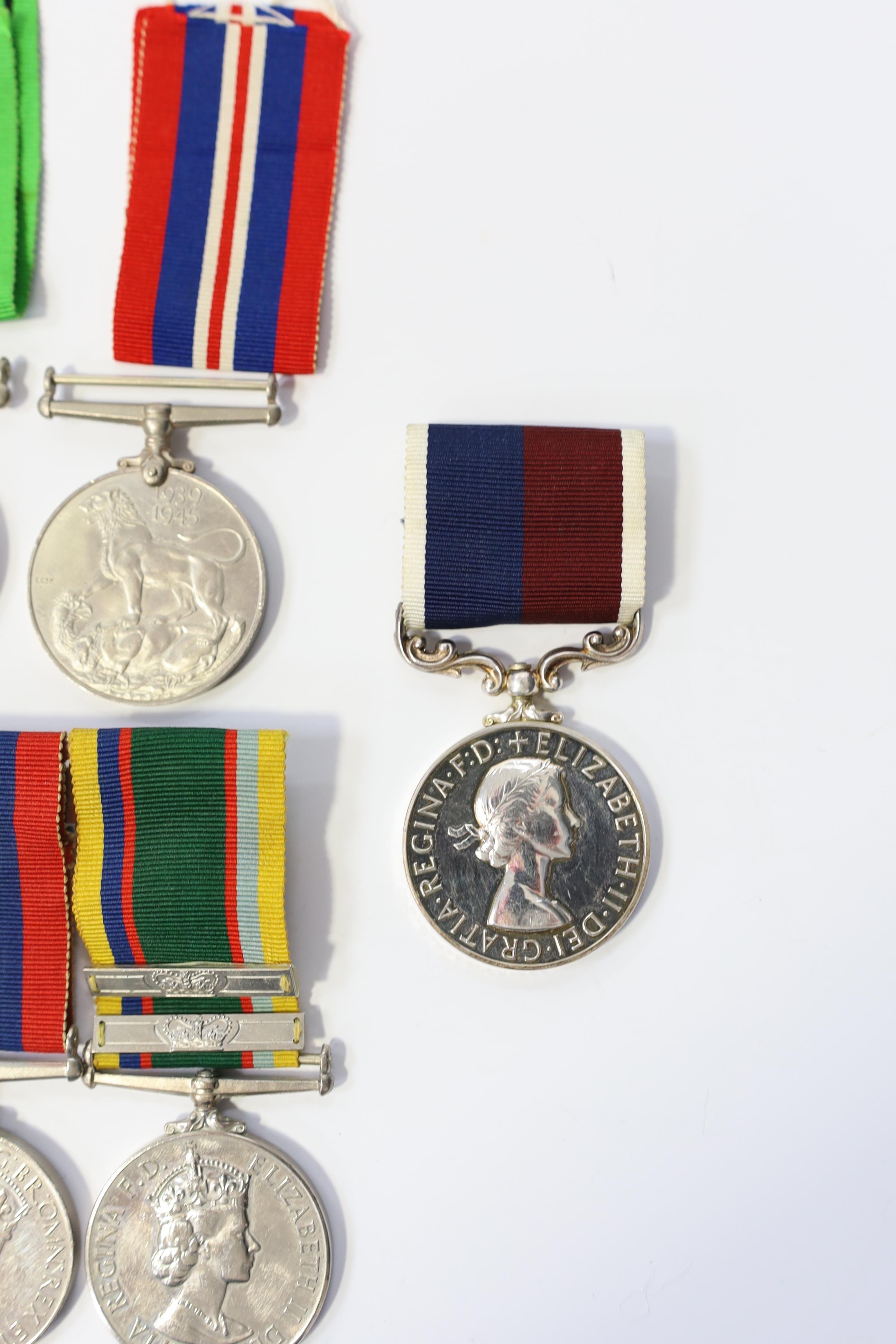 A group of assorted medals; WW2/ERII Cadet Forces medal group of 3 with two clasps to Fg.Off.W.K.Winstone R.A.F.V.R.(T); ERII RAFLSGC to Cpl B.K.Stockwell (F2570477) in box; WW2 Dm & WM. Condition - fair to good.